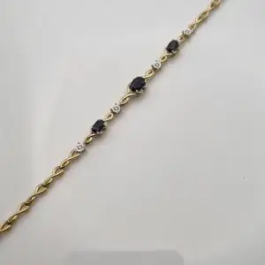 9CT YELLOW GOLD & DIAMOND SAPPHIRE TWIST BRACELET